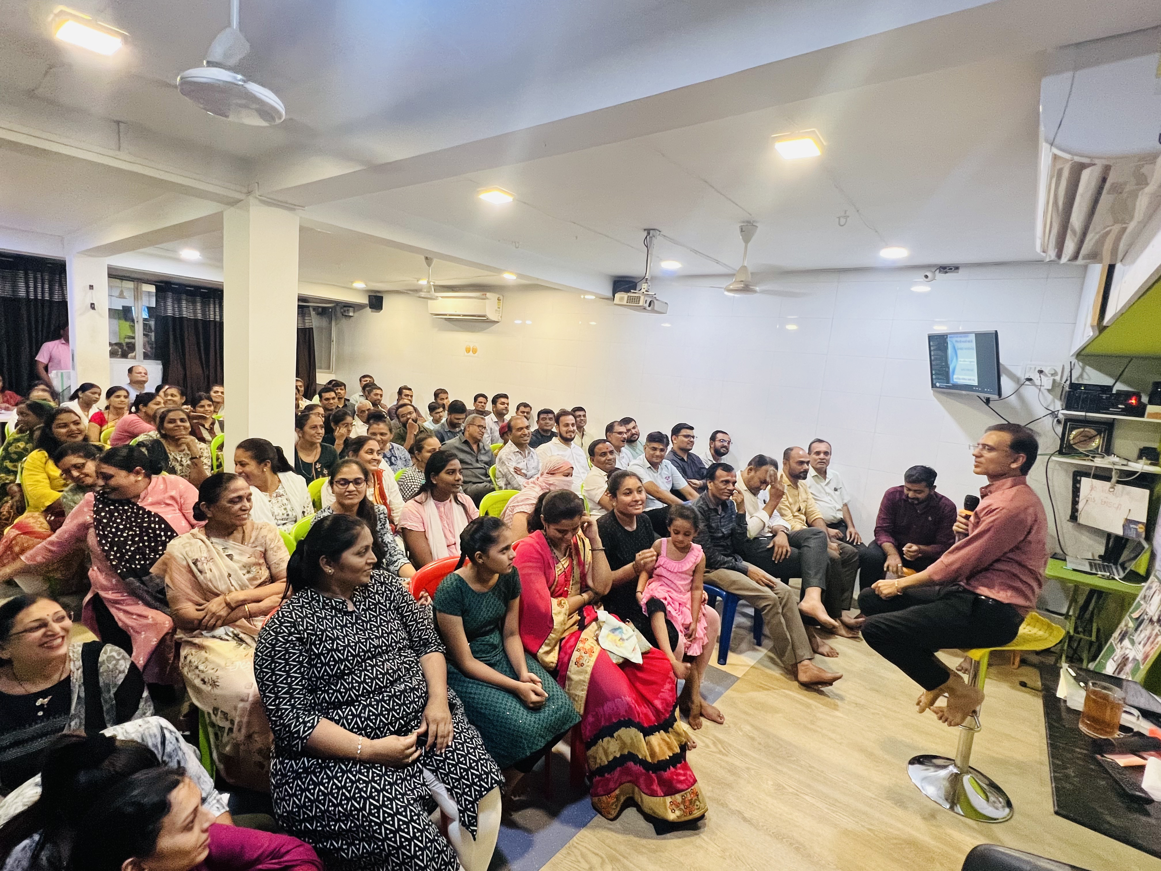 A large group of community members gathered for a wellness session