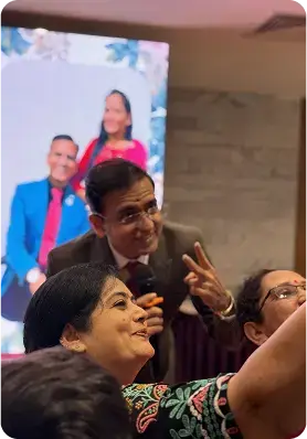 Amit Sarvaiya speaking with community members at a coaching session